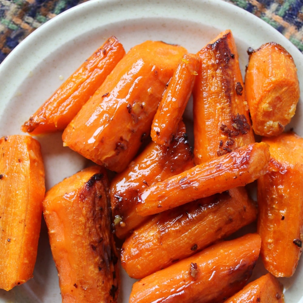 I love the flavor that comes out when you roast vegetables. These roasted garlic butter carrots are a wonderful side dish that pairs well with most any dinner recipe!