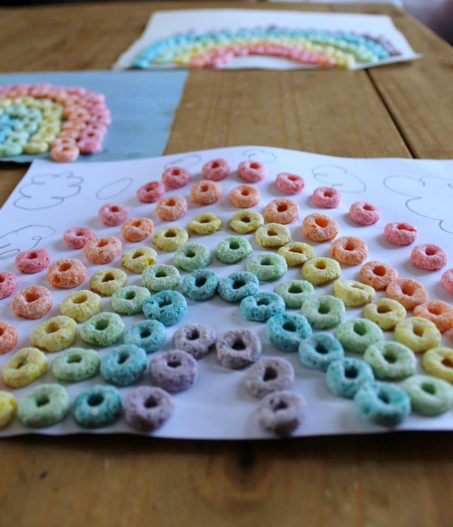 Fruit Loops Rainbows are a fun and delicious St. Patrick's Day craft for children of all ages! Great for practicing fine motor skills and gluing skills!
