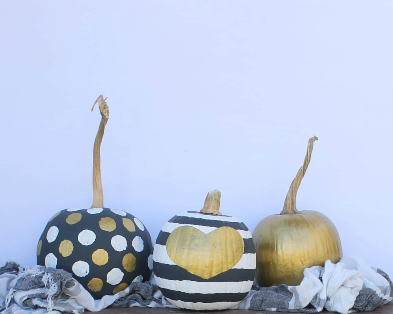 Classy black and gold pumpkins are a fun way to decorate for fall!