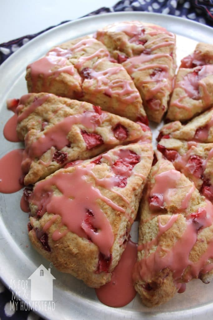 Strawberry Scones make a great spring breakfast or treat.  They've got delicious, fresh strawberries throughout, and they're drizzled with strawberry glaze.